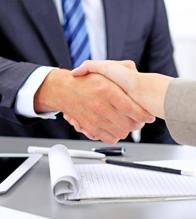 Two business professionals shaking hands